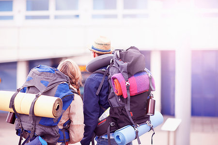 simsearch:649-08086253,k - Backpacker couple entering airport Stock Photo - Premium Royalty-Free, Code: 649-09195564