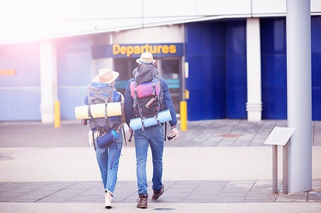simsearch:649-08086253,k - Backpacker couple entering airport Stock Photo - Premium Royalty-Free, Code: 649-09195565