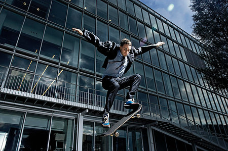 simsearch:649-07710443,k - Skateboarder showing off his skills Stock Photo - Premium Royalty-Free, Code: 649-09205525