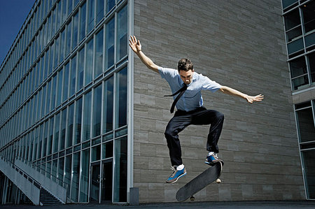 simsearch:649-07710443,k - Skateboarder showing off his skills Stock Photo - Premium Royalty-Free, Code: 649-09205526