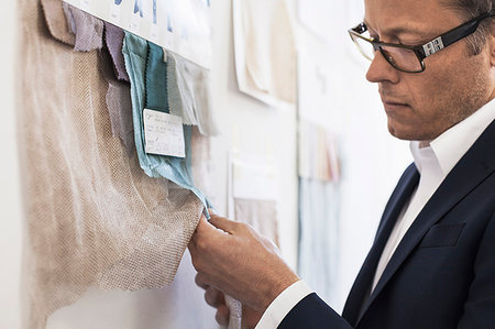 simsearch:649-06845199,k - Businessman examining fabric swatches Stock Photo - Premium Royalty-Free, Code: 649-09206124
