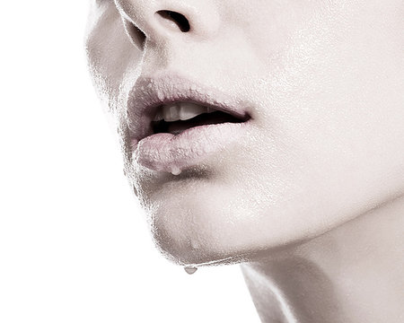 Woman with liquid droplets on lips, close up Stock Photo - Premium Royalty-Free, Code: 649-09206950