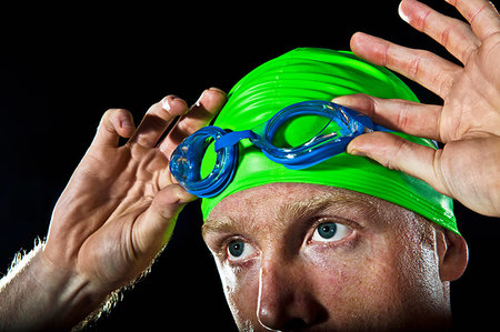 simsearch:614-06442313,k - Close up of swimmer with goggles and swimming cap Stock Photo - Premium Royalty-Free, Code: 649-09206953