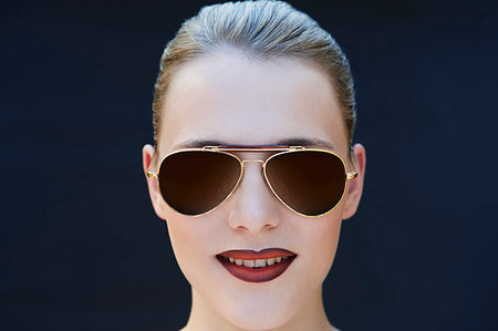 simsearch:649-07436630,k - Young woman wearing sunglasses Stock Photo - Premium Royalty-Free, Code: 649-09207464