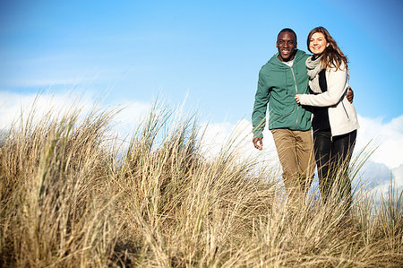 simsearch:649-07520320,k - Young couple strolling in sand dunes, Bournemouth, Dorset, UK Photographie de stock - Premium Libres de Droits, Code: 649-09207614