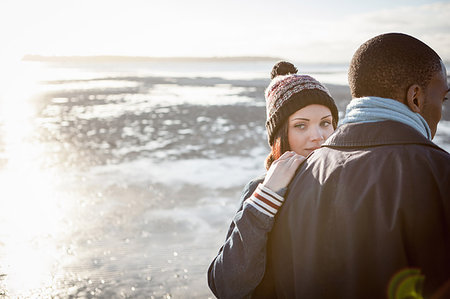 simsearch:614-06898128,k - Romantic young couple walking on the beach Stock Photo - Premium Royalty-Free, Code: 649-09207633
