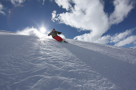 Mid adult man skiing downhill, Mayrhofen, Tyrol, Austria Stock Photo - Premium Royalty-Free, Code: 649-09207649