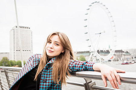 simsearch:649-08922723,k - Portrait of young female tourist posing on Golden Jubilee footbridge, London, UK Stock Photo - Premium Royalty-Free, Code: 649-09207710