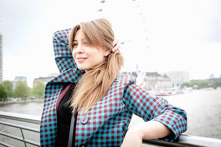simsearch:649-08922723,k - Young female tourist leaning against railings on Golden Jubilee footbridge, London, UK Stock Photo - Premium Royalty-Free, Code: 649-09207712