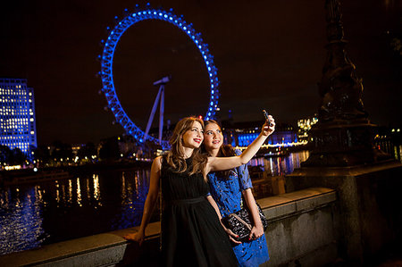 simsearch:649-07736862,k - Two young female friends taking self portrait at night, London, UK Stock Photo - Premium Royalty-Free, Code: 649-09207725