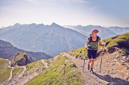 Mature woman hiking along mountain path, Karwendel-Mittenwald, Bavaria, Germany Stock Photo - Premium Royalty-Free, Code: 649-09208848