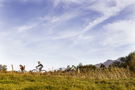 simsearch:649-07280282,k - Side view of family riding bicycles on farmland Stock Photo - Premium Royalty-Free, Code: 649-09209174