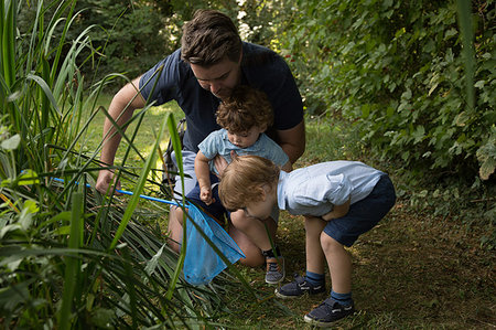 simsearch:649-07437107,k - Father and children with fishing net in park Stock Photo - Premium Royalty-Free, Code: 649-09212825