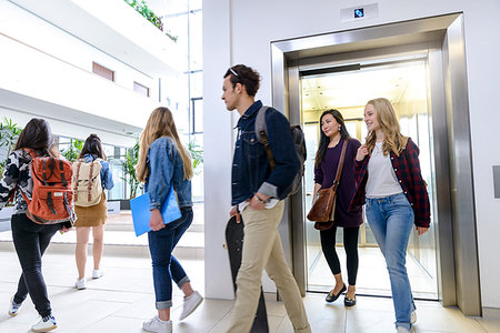 University students exiting elevator in campus Stock Photo - Premium Royalty-Free, Code: 649-09212844