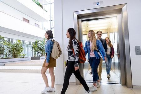 University students exiting elevator in campus Stock Photo - Premium Royalty-Free, Code: 649-09212842