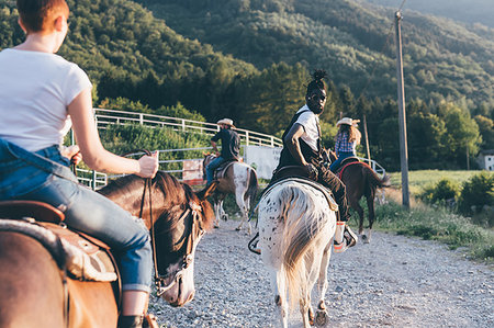 simsearch:6102-08542382,k - Adult friends riding horses on rural dirt track, rear view, Primaluna, Trentino-Alto Adige, Italy Stock Photo - Premium Royalty-Free, Code: 649-09213012