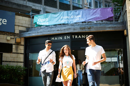 simsearch:640-02765460,k - Teenage girl with young male higher education students leaving college campus Stock Photo - Premium Royalty-Free, Code: 649-09230240