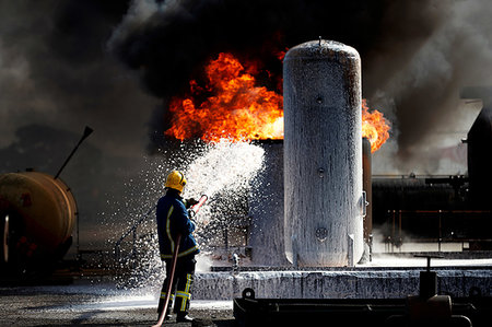 foam (spongy material) - Fireman training to put out fire on burning tanks, Darlington, UK Stock Photo - Premium Royalty-Free, Code: 649-09230489