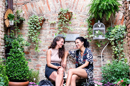 Friends enjoying peaceful corner with plants, Città della Pieve, Umbria, Italy Stock Photo - Premium Royalty-Free, Code: 649-09245777