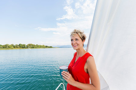 simsearch:649-08900720,k - Mature woman having coffee while sailing on Chiemsee lake, Bavaria, Germany Stock Photo - Premium Royalty-Free, Code: 649-09246488