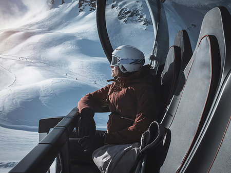 simsearch:649-08924209,k - Young woman skier wearing helmet and ski goggles looking out from ski lift,  Alpe Ciamporino, Piemonte, Italy Stock Photo - Premium Royalty-Free, Code: 649-09246581