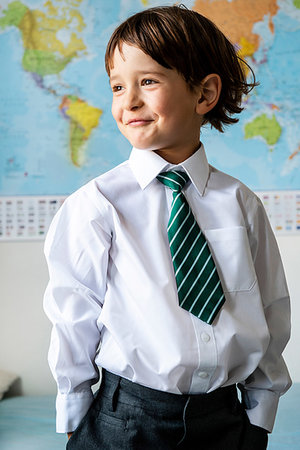 simsearch:614-06116419,k - Portrait of boy in school uniform, World map in background Stock Photo - Premium Royalty-Free, Code: 649-09257280