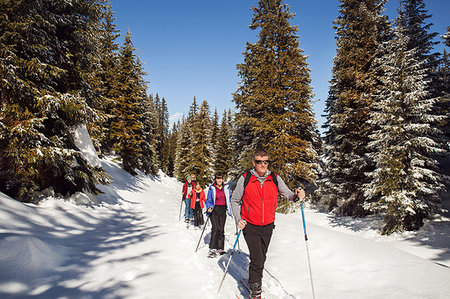 simsearch:649-08924209,k - Mature couple and daughters snowshoeing in snow covered forest landscape, Styria, Tyrol, Austria Stock Photo - Premium Royalty-Free, Code: 649-09258146