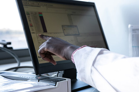 simsearch:649-07585094,k - Young female scientist pointing at computer screen in laboratory, cropped Stock Photo - Premium Royalty-Free, Code: 649-09258368