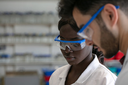 simsearch:649-08085222,k - Young male and female scientists wearing protective goggles in laboratory, close up Stock Photo - Premium Royalty-Free, Code: 649-09258397