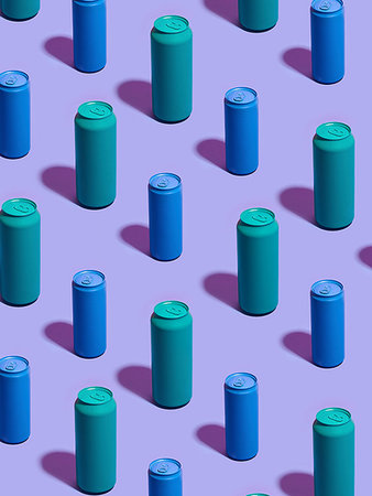 Still life of turquoise and blue drink cans in diagonal rows on purple background Stock Photo - Premium Royalty-Free, Code: 649-09258406