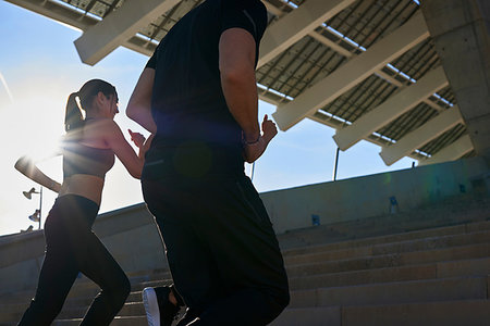 simsearch:614-07239995,k - Friends jogging up steps in sports stadium Stock Photo - Premium Royalty-Free, Code: 649-09250777