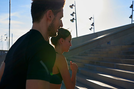 simsearch:649-07520907,k - Friends jogging up steps in sports stadium Stock Photo - Premium Royalty-Free, Code: 649-09250779