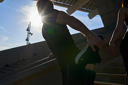 simsearch:649-07520907,k - Man stretching on steps in sports stadium Stock Photo - Premium Royalty-Free, Code: 649-09250784