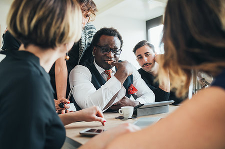 simsearch:614-06043814,k - Businessmen and businesswomen having discussion in loft office Stock Photo - Premium Royalty-Free, Code: 649-09251084