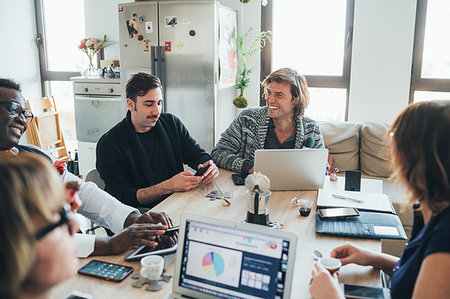 simsearch:614-06043814,k - Businessmen and businesswomen having discussion in loft office Stock Photo - Premium Royalty-Free, Code: 649-09251080