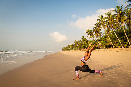 simsearch:649-07760822,k - Woman practising yoga on beach Stock Photo - Premium Royalty-Free, Code: 649-09251954