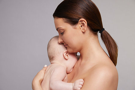 simsearch:632-08001820,k - Mother hugging baby Stock Photo - Premium Royalty-Free, Code: 649-09275911