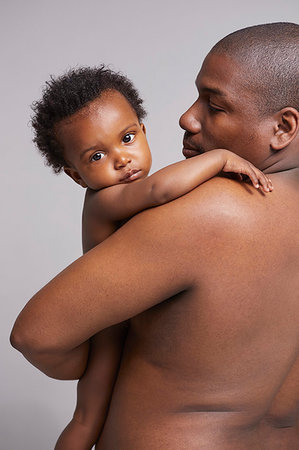 simsearch:6116-07236010,k - Father hugging baby Stock Photo - Premium Royalty-Free, Code: 649-09275940