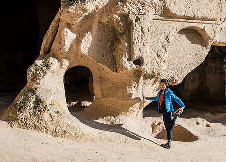 simsearch:700-08743683,k - Woman practising yoga in Selime Monastery, Göreme, Cappadocia, Nevsehir, Turkey Stock Photo - Premium Royalty-Free, Code: 649-09276041