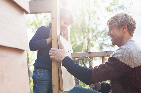 simsearch:649-09078617,k - Father and son building treehouse together in garden Stock Photo - Premium Royalty-Free, Code: 649-09277415