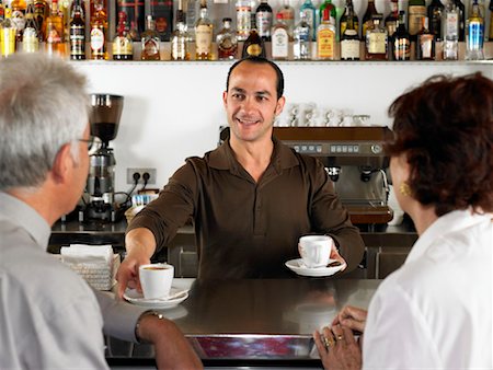Businesspeople at a bar drinking coffee. Stock Photo - Premium Royalty-Free, Code: 649-01609390