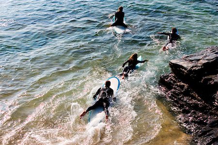 simsearch:632-01150248,k - Four people on surfboards in the water. Foto de stock - Sin royalties Premium, Código: 649-01696048