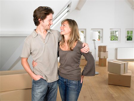 simsearch:649-01696405,k - Couple moving into new home smiling. Stock Photo - Premium Royalty-Free, Code: 649-01696474