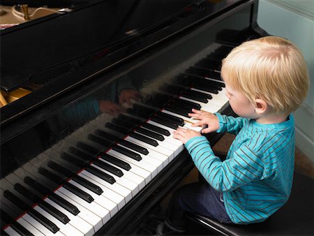 Little boy playing piano. Stock Photo - Premium Royalty-Free, Code: 649-01754295