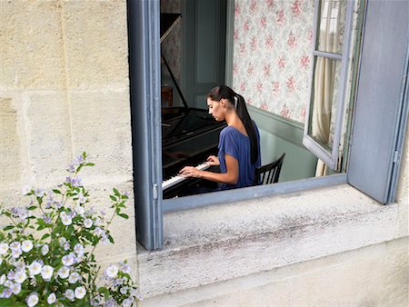 Woman playing piano. Stock Photo - Premium Royalty-Free, Code: 649-01754292
