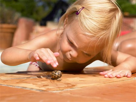 simsearch:649-01696512,k - Little girl playing with a snail. Stock Photo - Premium Royalty-Free, Code: 649-01754324