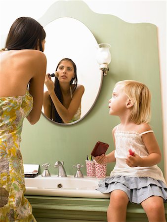 family bathroom mirror - Mother and daughter applying makeup. Stock Photo - Premium Royalty-Free, Code: 649-01754337