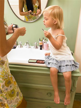 simsearch:649-01696512,k - Mother and daughter applying makeup. Stock Photo - Premium Royalty-Free, Code: 649-01754338