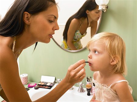 simsearch:649-01696512,k - Mother and daughter applying makeup. Stock Photo - Premium Royalty-Free, Code: 649-01754344