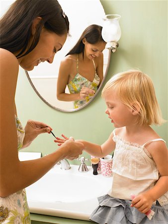 family bathroom mirror - Mother and daughter applying makeup. Stock Photo - Premium Royalty-Free, Code: 649-01754343